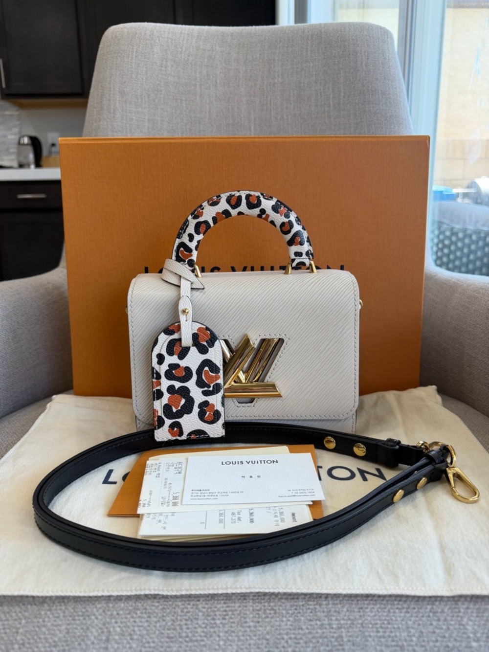 LIMITED EDITION EPI TWIST BI-COLOR LEOPARD TOP HANDLE CROSSBODY BAG